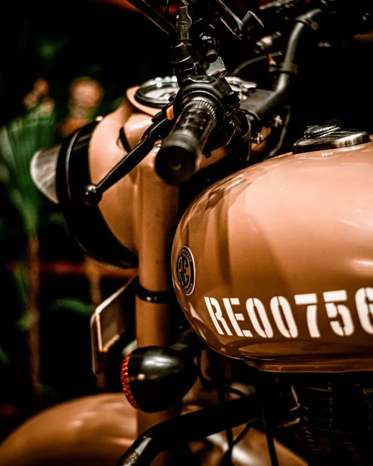 a close up of a motorcycle parked inside bike rental srinagar garage