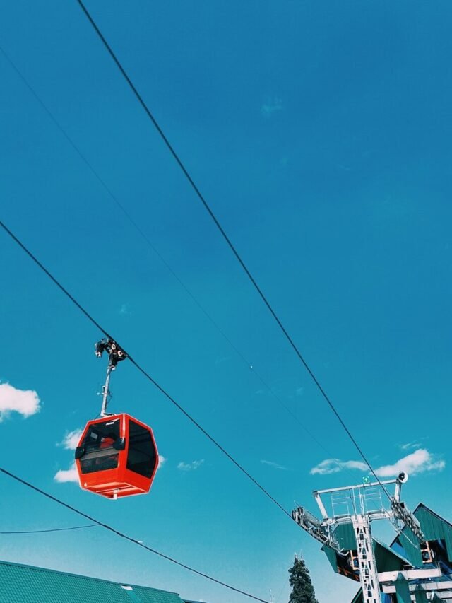 Gulmarg Gondola cable cars with mountain landscape and travel update announcing temporary closure till 08 June 2026.